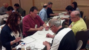  Attendees break into groups to review materials presented to this point, to ask speakers questions and/or discuss materials with other attendees. Starting clockwise with Melvin Kerr from Warehouse and Logistics Las Vegas (red shirt), Steve Kloos from Keller Warehousing, Ty Gilliam from Kelller Warehousing and Michelle Middleton, from Ohio Logistics-Findlay's Timber.